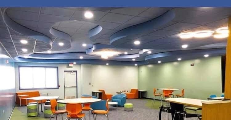 Modern learning space with custom acoustical ceiling design