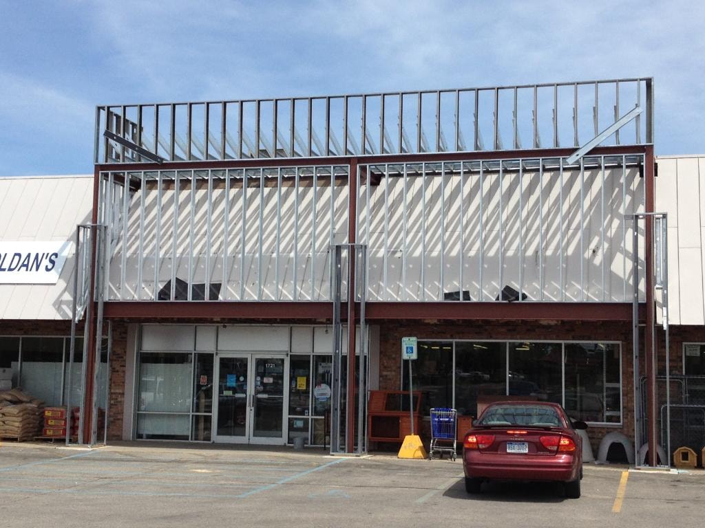 Industrial storefront with metal framework facade